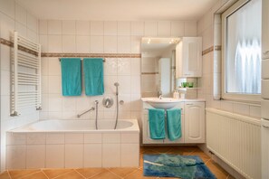 Separate tub and shower, hair dryer, towels