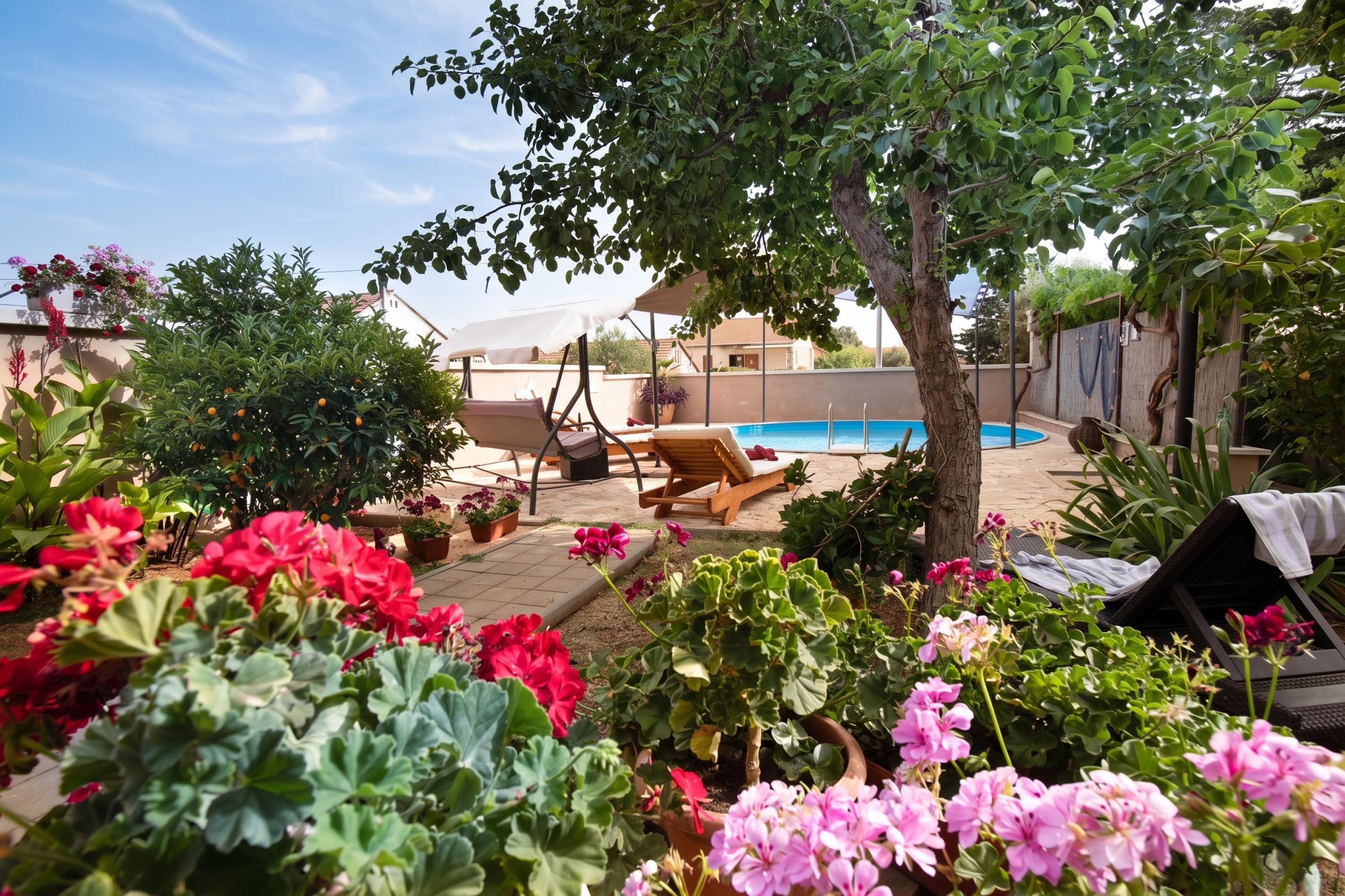 A backyard with a swimming pool, lounge chairs, and potted plants.
