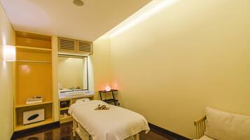 Relax in a serene space with a neatly made bed, bedside table, and wardrobe.