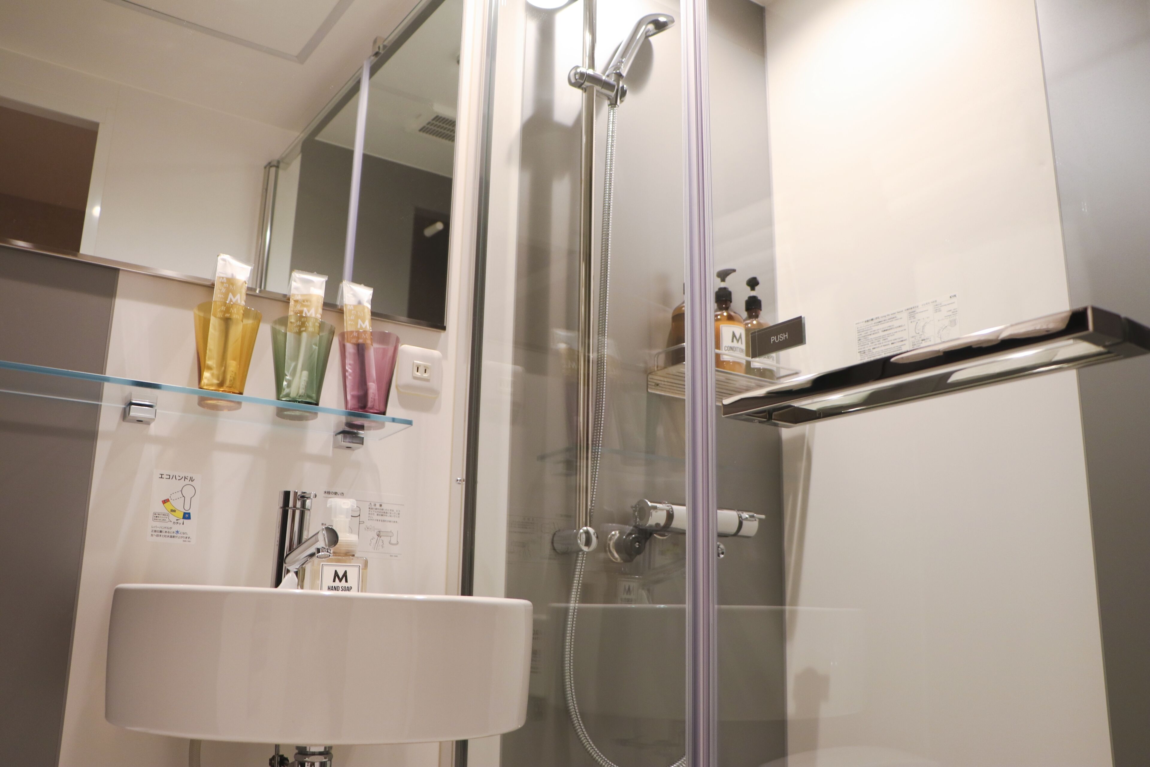 rainfall showerhead, hair dryer, slippers, bidet