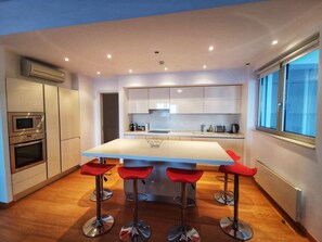 Luxury Apartment | Private kitchen | Microwave, oven, dishwasher, cookware/dishes/utensils