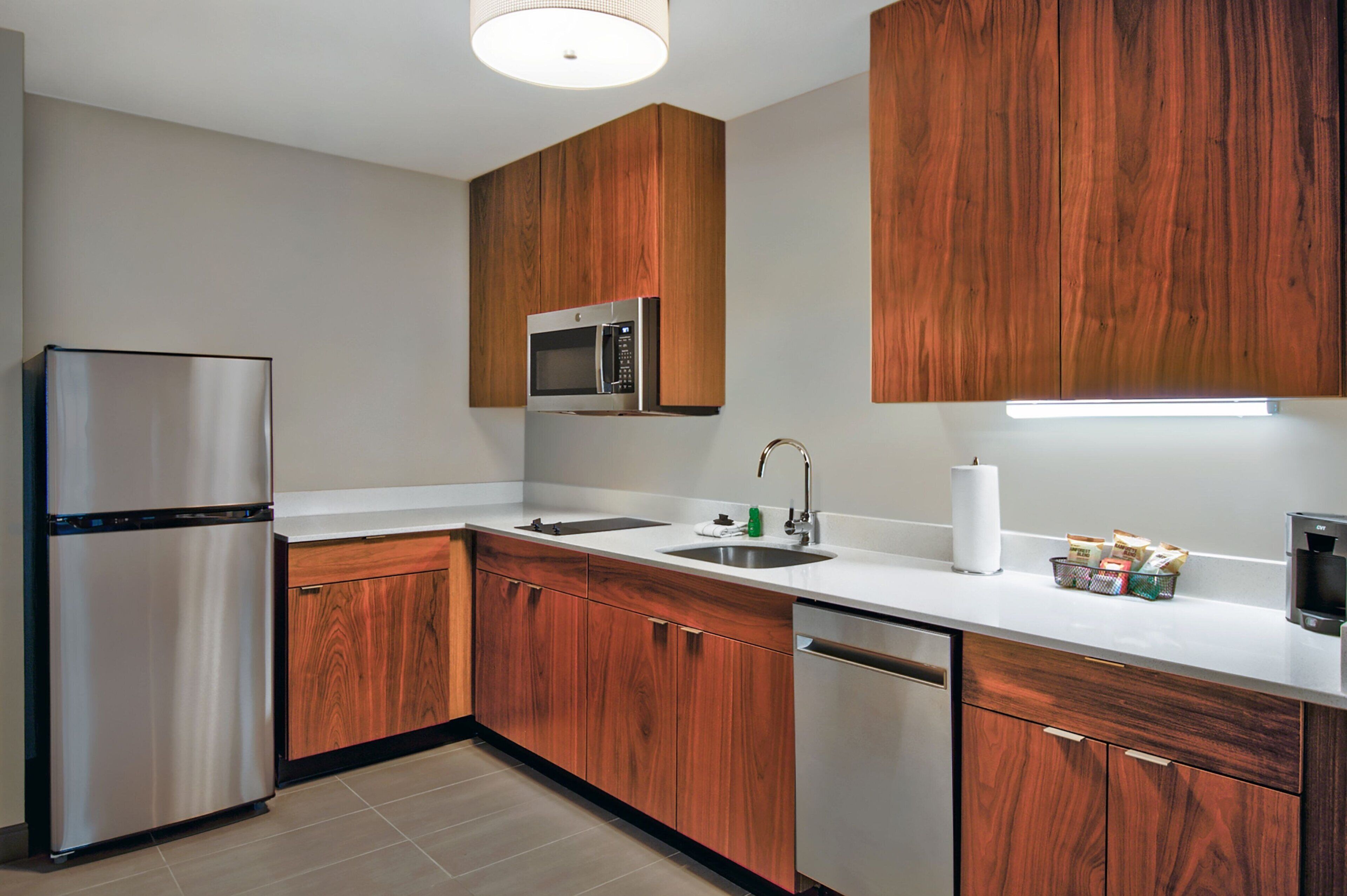 full-sized fridge, microwave, stovetop, dishwasher