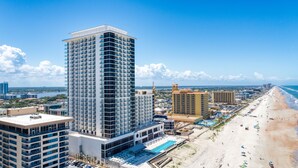 A high-rise hotel with multiple floors, a rooftop pool, and a beachside location. - Daytona Grande Oceanfront Resort (Daytona Beach)