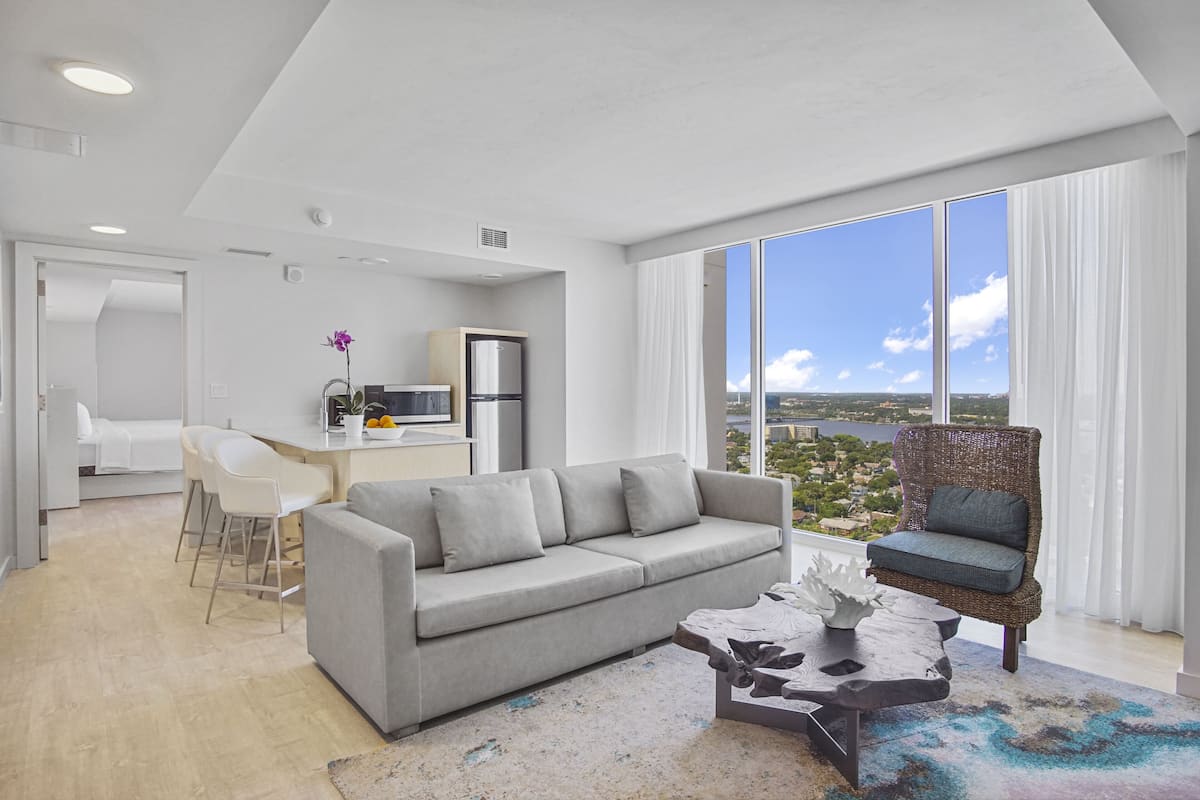 premium suite, 2 bedrooms with river view | living area | 55-inch lcd tv with digital channels, tv