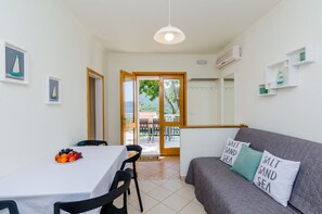 Apartment (One Bedroom Apartment with Terrace an) | Living room | Flat-screen TV