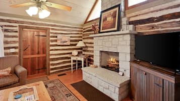 Cabin, 1 Bedroom | Living area | Smart TV, fireplace