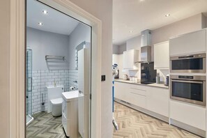 Shower, hair dryer, towels, toilet paper