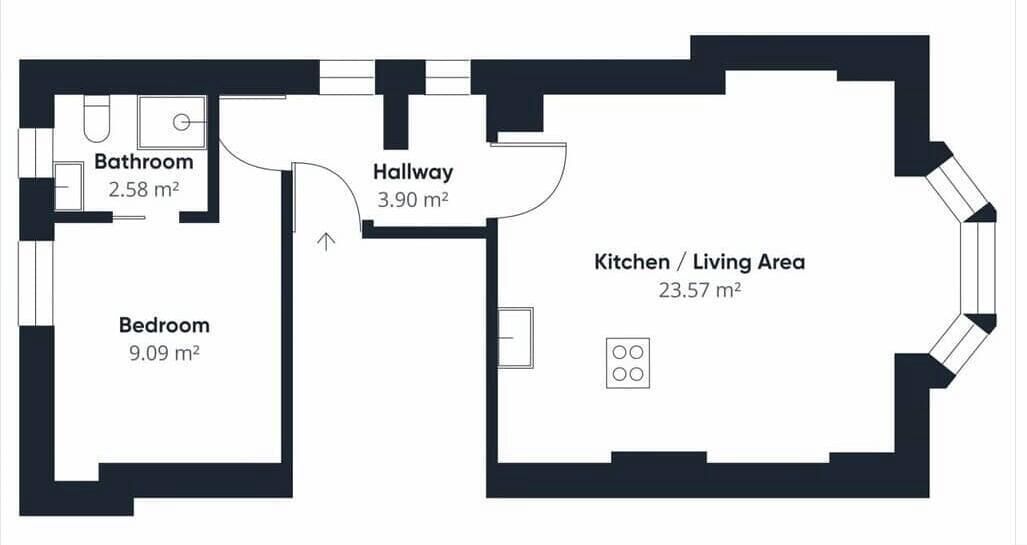 Pianta dell'appartamento con camera da letto (9,09 m²), bagno (2,58 m²), disimpegno (3,90 m²) e angolo cucina/soggiorno (23,57 m²).