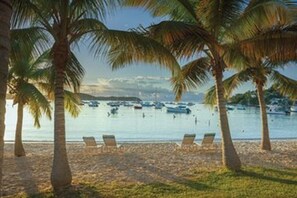 On the beach, sun loungers, beach towels