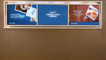 A framed advertisement for Springhill Suites Frederick featuring a breakfast pastries section.