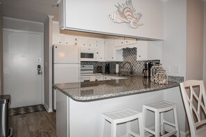 Fridge, microwave, oven, stovetop - Two Bedroom Oceanfront Oasis: Relax and Unwind at Our Sea Master Beach Condo (Garden City Beach)