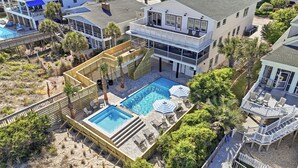 A multi-story building with a swimming pool, outdoor seating, and a covered deck area. - Cat Daddy 11 bedroom in North Litchfield, Pawleys Island (Pawleys Island)