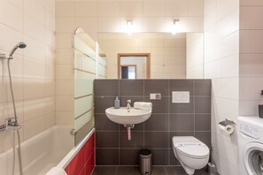Combined shower/tub, hair dryer, towels, soap