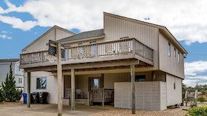 A two-story house with a balcony, a covered porch, and a garage. - Oceanview, Private Pool, Sleeps 16, Dogs okay, close to beach, PICKLEBALL COURT! (Virginia Beach)
