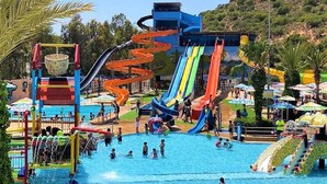 A water park with multiple slides and a pool area. - Lunja Village Agadir 5063 (Imi Ouaddar)