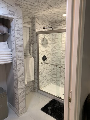 Shower, hair dryer, towels, soap