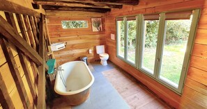 Bathtub, hair dryer, towels, soap