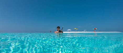 Beach nearby, white sand, sun loungers, beach umbrellas