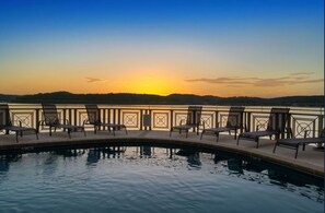 Outdoor pool, a heated pool, sun loungers