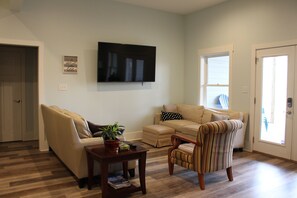 Smart TV, fireplace, books, computer monitors