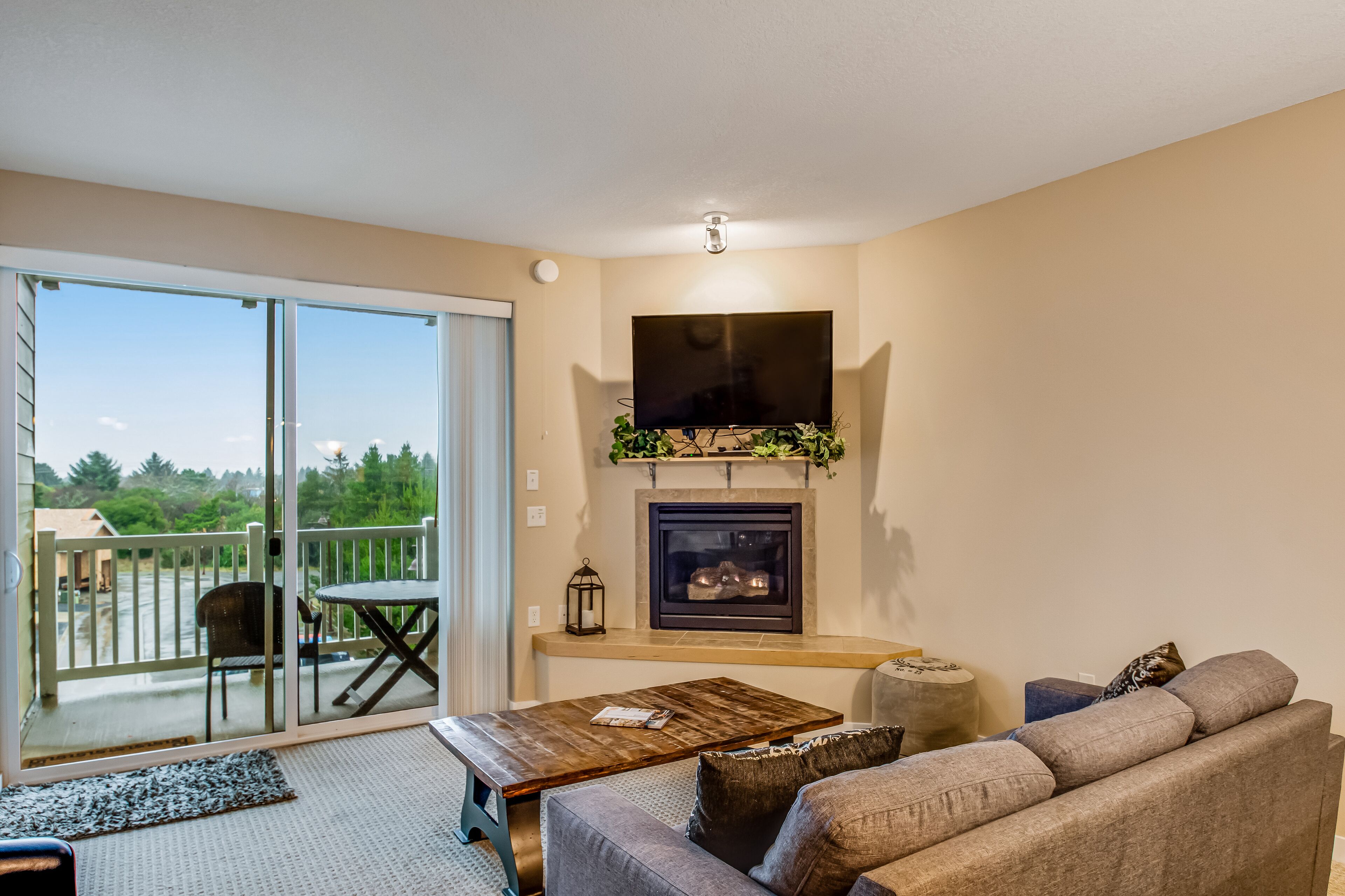 Dog-friendly coastal gem with balcony, fireplace, & beach access