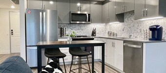 Work Here • Secure • Elevator • Luxe Kitchen & Bath • King Bed • W/D • Gig WiFi