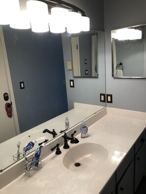 Combined shower/bathtub, towels, soap, shampoo