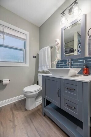 Bathtub, hair dryer, towels