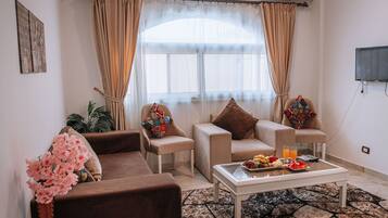 Apartment, 1 Bedroom, Accessible, Smoking | Living area | Flat-screen TV