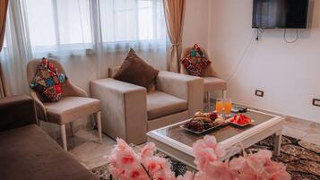 Apartment, 1 Bedroom, Accessible, Smoking | Living area | Flat-screen TV