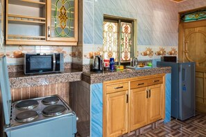 Apartment, 3 Bedrooms, Balcony, City View | Private kitchen | Fridge, microwave, cookware/dishes/utensils - Spacious Apartment in Secure Resort, 4-6 People (Kampala)