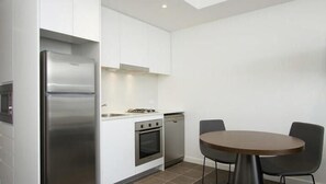 City Studio | Private kitchenette | Full-sized fridge, microwave, oven, stovetop