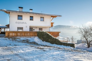 A two-story building with a sign reading 'Schönblick.'