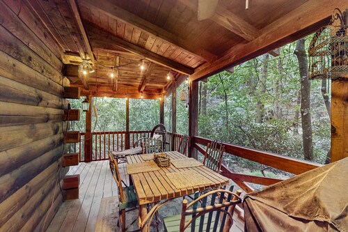 Quaint, dog-friendly cabin with private hot tub, firepit, loft, porch & creek