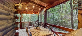 Quaint, dog-friendly cabin with private hot tub, firepit, loft, porch & creek