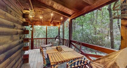 Quaint, dog-friendly cabin with private hot tub, firepit, loft, porch & creek
