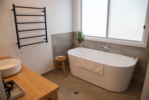 Bathtub, hair dryer, towels, soap