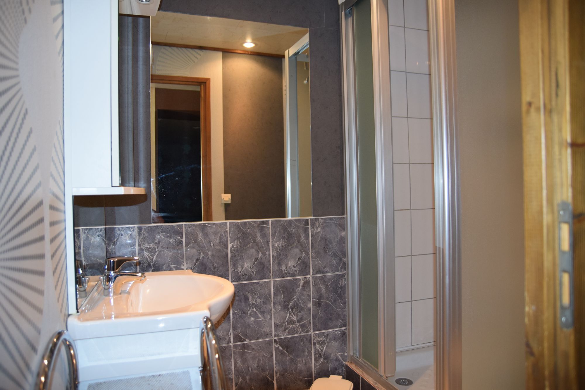 Shower, hair dryer, towels, toilet paper