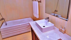 Deluxe Double Room | Bathroom | Combined shower/tub, soap, shampoo