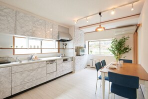 Deluxe House | Living area | 32-inch flat-screen TV with digital channels, TV, fireplace - Ryoushi Minpaku CHOUTA (Awaji)