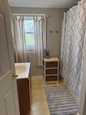 Combined shower/tub, hair dryer, towels, toilet paper