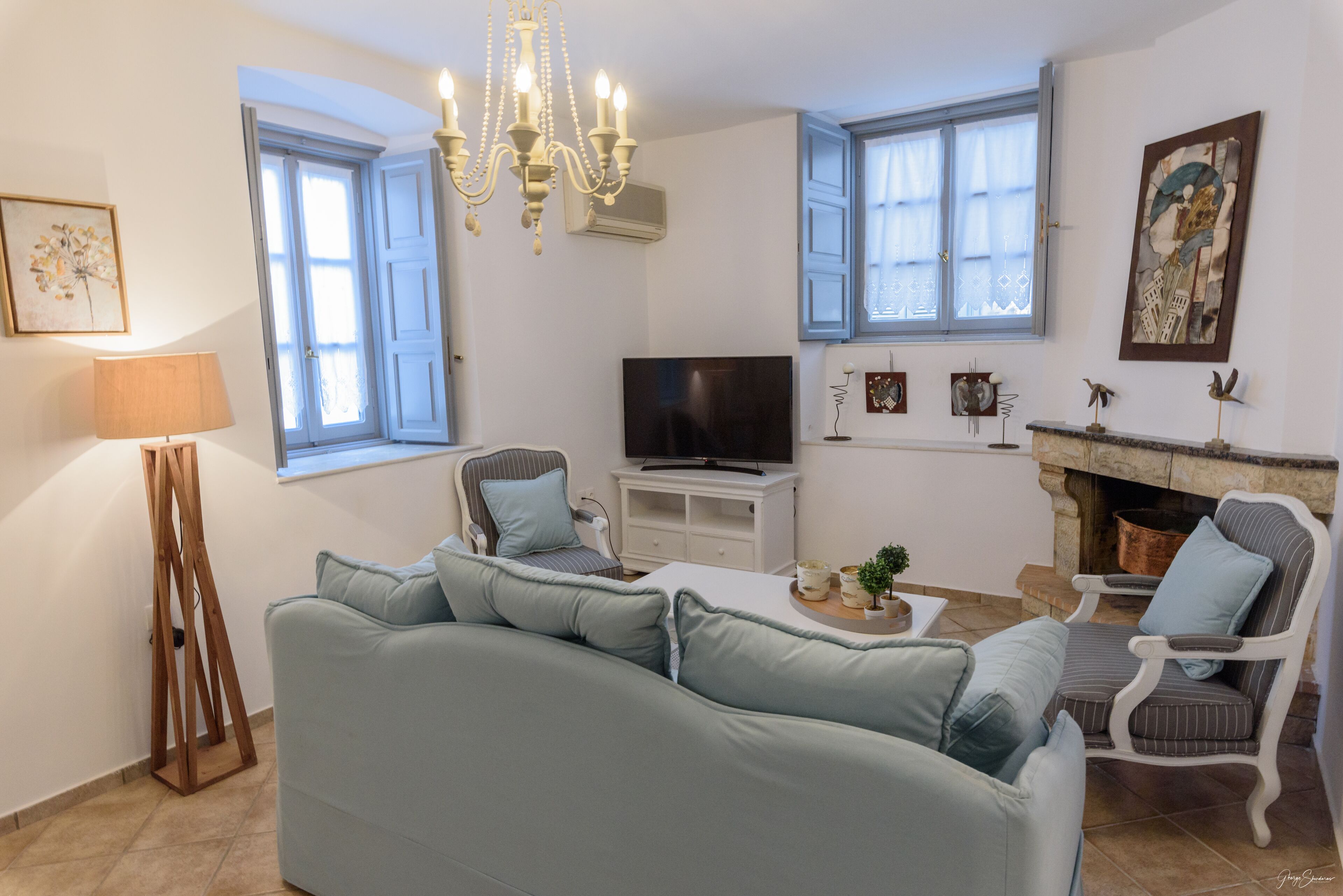 Luxury Apartment | Living area | 50-inch Smart TV with cable channels, TV, fireplace