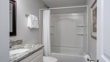 Combined shower/tub, hair dryer, towels, soap