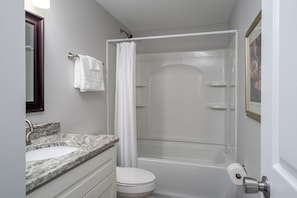 Combined shower/tub, hair dryer, towels, soap