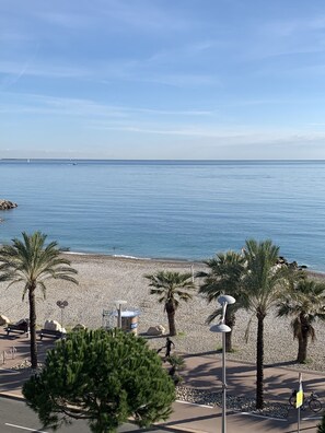 On the beach, sun loungers, beach towels