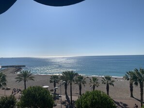On the beach, sun-loungers, beach towels