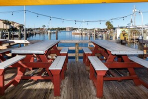 Enjoy waterfront dining with a marina view from our outdoor tables.