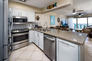 Enjoy meals in the kitchen with stainless steel appliances and a granite countertop, then dine al fresco on the balcony overlooking the ocean.