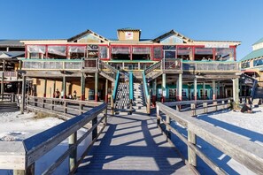 Walk along the coastal boardwalk to this vibrant commercial establishment with outdoor seating areas.