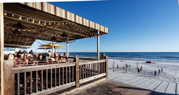 Dine on the beach with a view of the ocean.